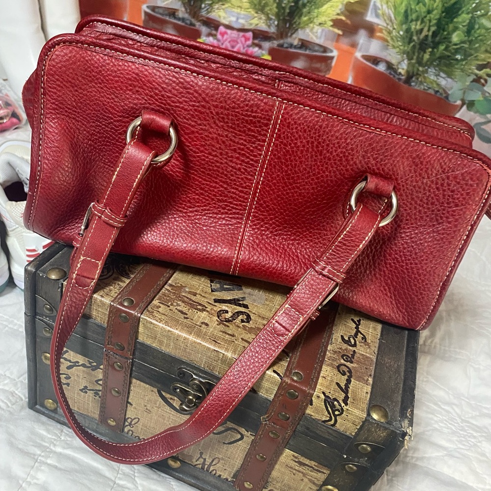 Like new. Used a couple days only. Red leather handbag. Ameri Leather.